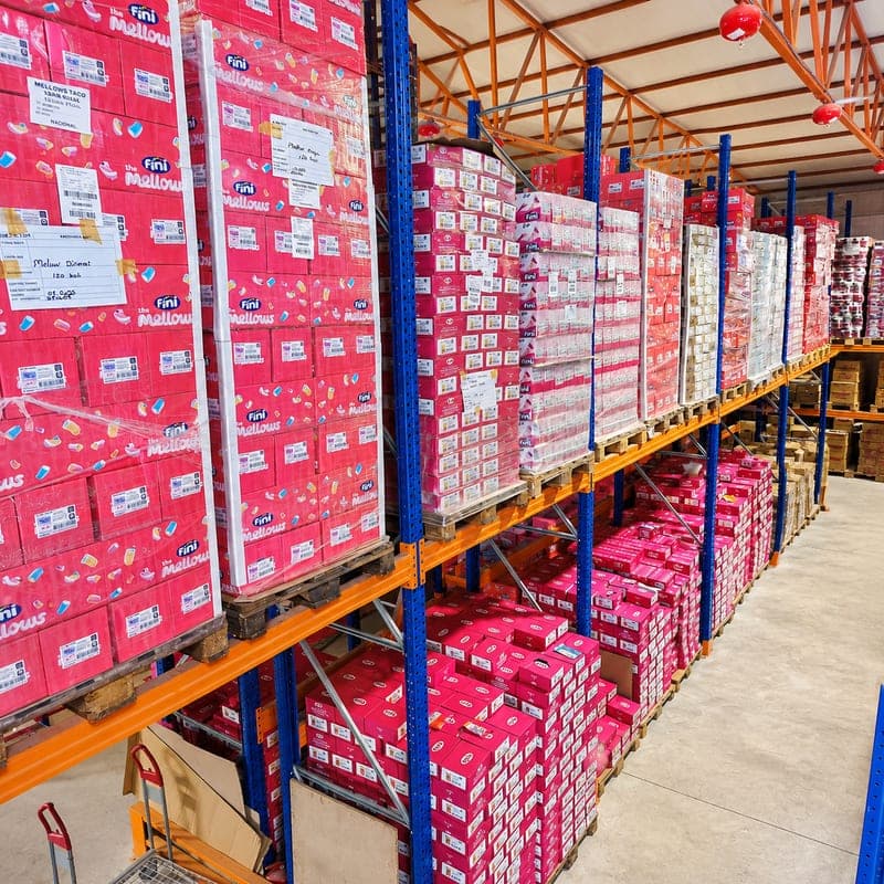 Labelled confectionery pallets on the racking